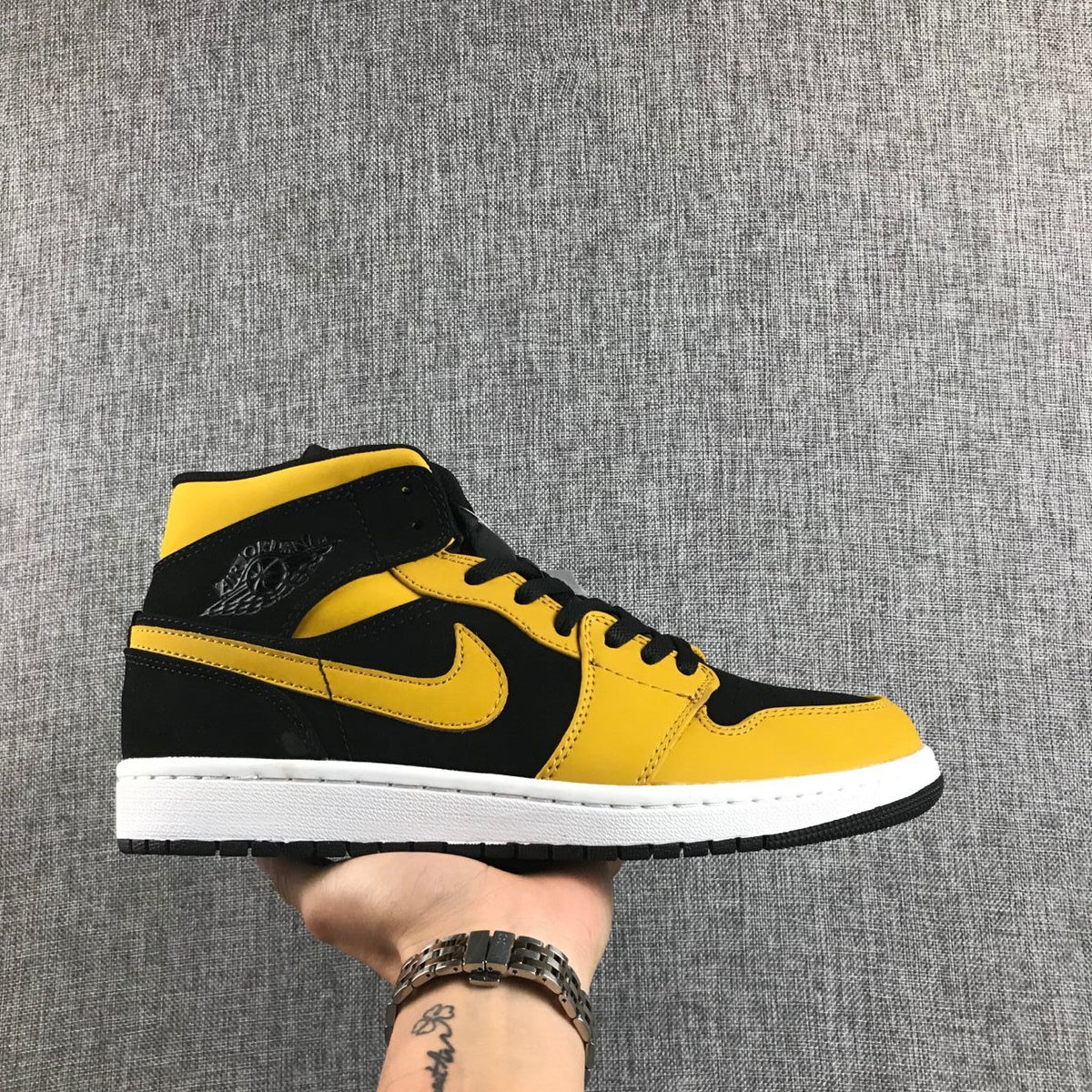 Air Jordan 1 Mid Black and Yellow Sneakers