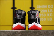Air Jordan 11 Retro Bred Black and Red High-Top Sneakers