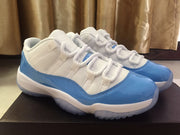 Jordan 11 Low Sneakers in White and University Blue
