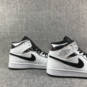 Air Jordan 1 Mid White and Black Sneakers