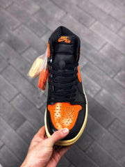 Air Jordan 1 Retro High OG Black and Orange Sneakers