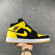 Air Jordan 1 Mid Black and Yellow Sneakers