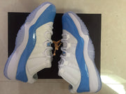 Jordan 11 Low Sneakers in White and University Blue
