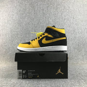Air Jordan 1 Mid Black and Yellow Sneakers