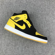 Air Jordan 1 Mid Black and Yellow Sneakers