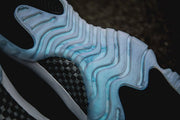 Air Jordan 11 Iridescent Sneakers in White and Black