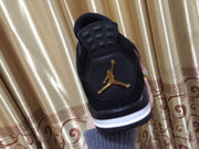 Jordan 4 Black and Gold High-Top Sneakers