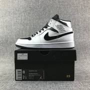 Air Jordan 1 Mid White and Black Sneakers