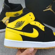 Air Jordan 1 Mid Black and Yellow Sneakers