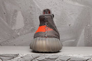 Yeezy 350 V2 Sneakers in Charcoal and Bright Orange