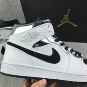 Air Jordan 1 Mid White and Black Sneakers