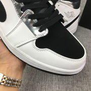 Air Jordan 1 Mid White and Black Sneakers
