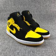 Air Jordan 1 Mid Black and Yellow Sneakers