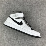 Air Jordan 1 Mid White and Black Sneakers
