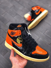 Air Jordan 1 Retro High OG Black and Orange Sneakers