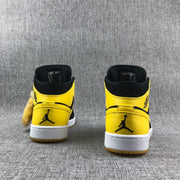 Air Jordan 1 Mid Black and Yellow Sneakers