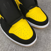 Air Jordan 1 Mid Black and Yellow Sneakers