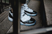 Air Jordan 11 Iridescent Sneakers in White and Black