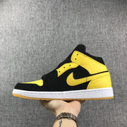 Air Jordan 1 Mid Black and Yellow Sneakers