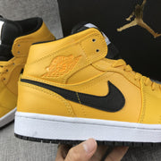 Air Jordan 1 Mid University Gold Black White Sneakers