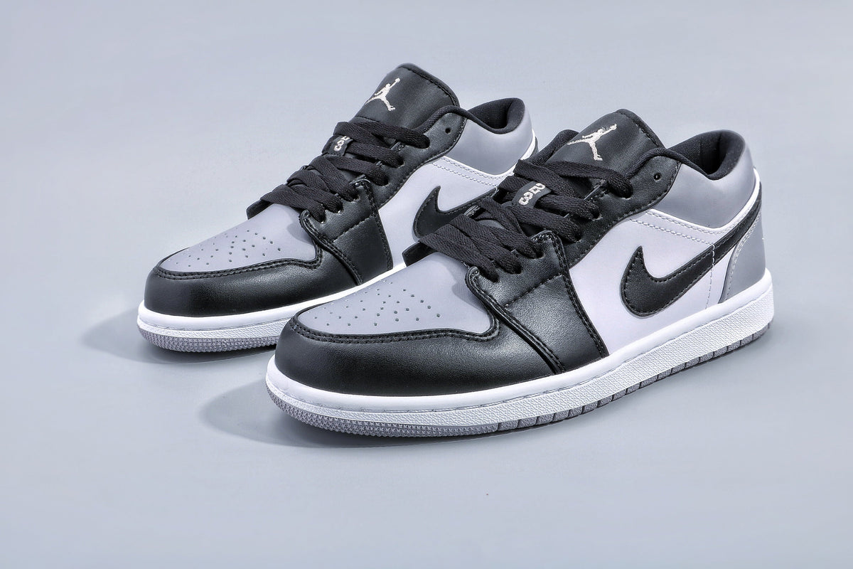 Jordan 1 Low Sneakers in Black and Grey