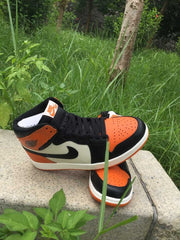 Jordan 1 High Sneakers in Black, White and Orange