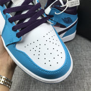 Air Jordan 1 Mid Sneakers in Blue, White and Black