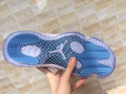 Jordan 11 Low Sneakers in White and University Blue