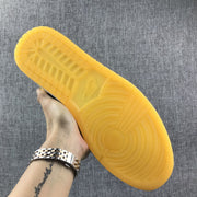 Air Jordan 1 Mid Black and Yellow Sneakers
