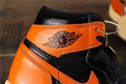 Air Jordan 1 Retro High OG Black and Orange Sneakers