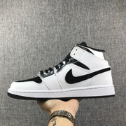 Air Jordan 1 Mid White and Black Sneakers