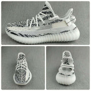Yeezy 350 V2 Knit Sneakers in Black and White