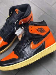 Air Jordan 1 Retro High OG Black and Orange Sneakers