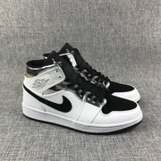 Air Jordan 1 Mid White and Black Sneakers