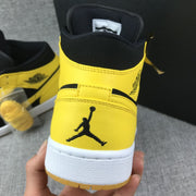 Air Jordan 1 Mid Black and Yellow Sneakers