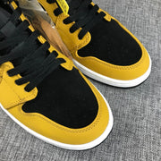 Air Jordan 1 Mid Black and Yellow Sneakers